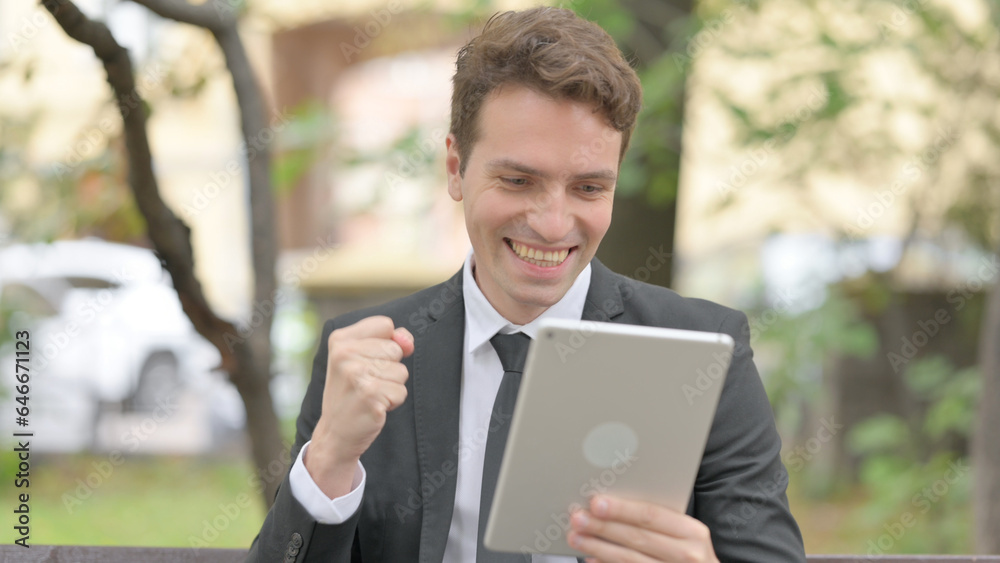 Businessman Celebrating Success on Tablet Outdoor Businessman Celebrating Success on Tablet Outdoor
