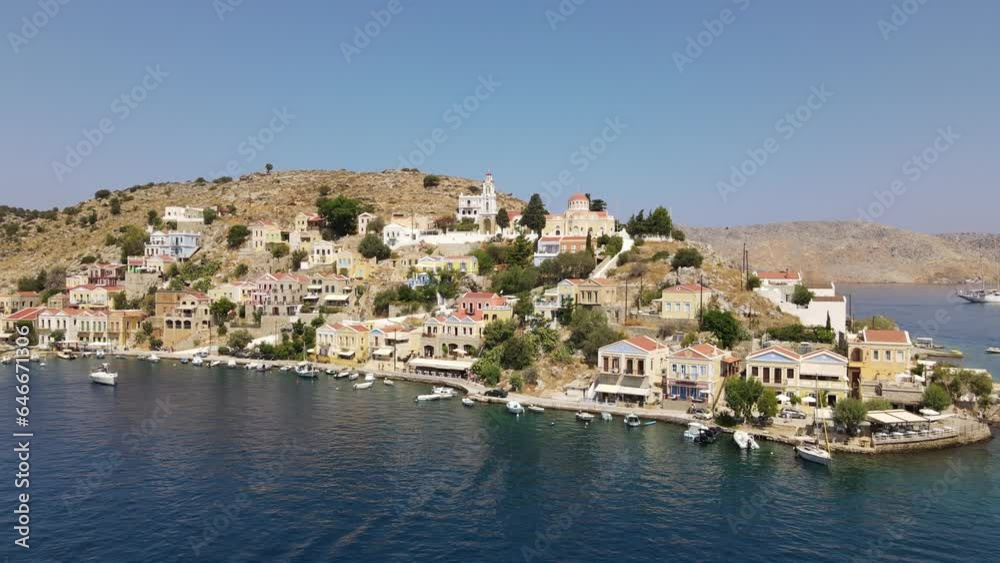 Mediterranean city on island Symi in Greece, aerial backward establisher Mediterranean city on island Symi in Greece, aerial backward establisher