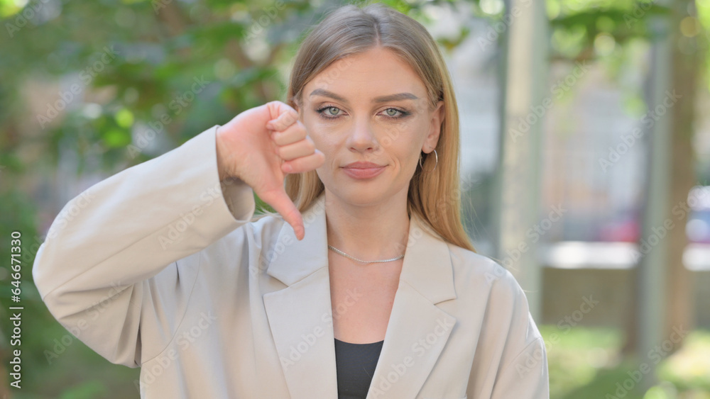 Portrait of Businesswoman with Thumbs Down, Outdoor Portrait of Businesswoman with Thumbs Down, Outdoor