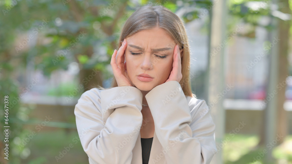 Outdoor Portrait of Businesswoman with Headache Outdoor Portrait of Businesswoman with Headache