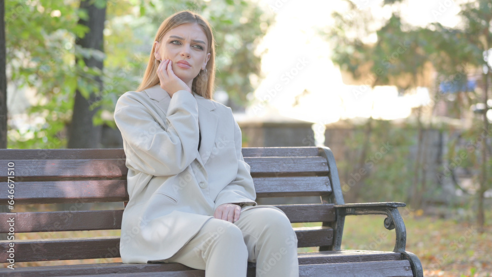 Young Business Lady with Toothache Sitting on Bench Young Business Lady with Toothache Sitting on Bench