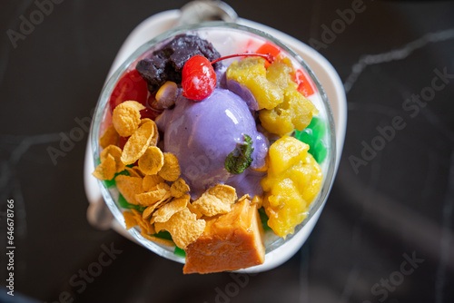 Filipino most favorite dessert, halo halo topped with ube ice cream