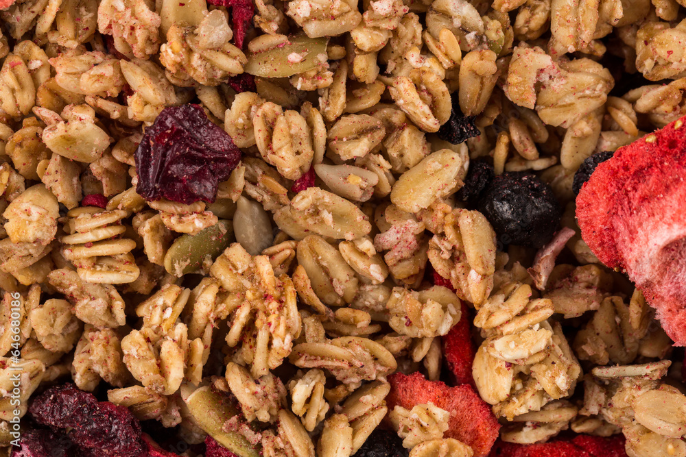 Muesli oat cereals close up background with dry fruits Muesli oat cereals close up background with dry fruits