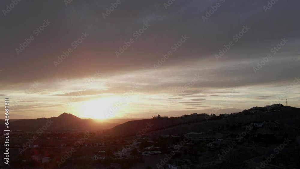 Aerial tilt-down of dramatic El Paso, TX sunset with silhouette buildings and skyline. Aerial tilt-down of dramatic El Paso, TX sunset with silhouette buildings and skyline.