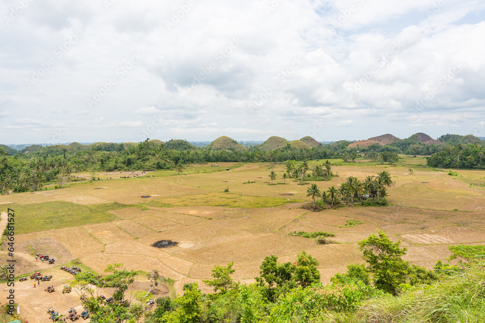 an overlooking of a farm and Chocolate hills