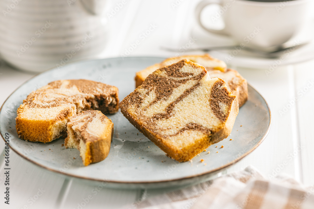 Marble sponge cake. Cake with cocoa and vanilla taste on plate. Marble sponge cake. Cake with cocoa and vanilla taste on plate.