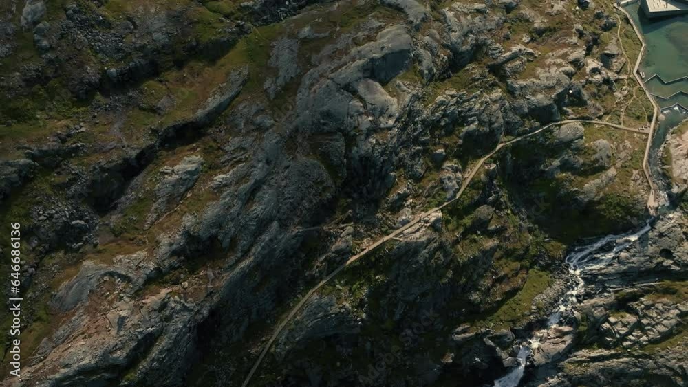 Beautiful aerial view of green and rocky surface of a Norwegian fjord in sunlight Beautiful aerial view of green and rocky surface of a Norwegian fjord in sunlight