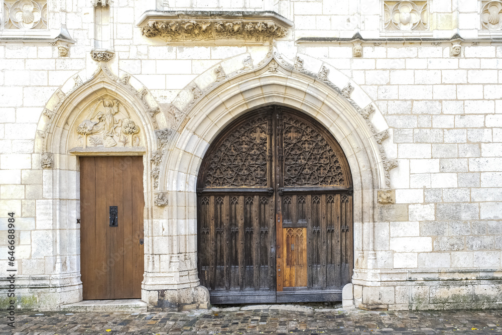 Bourges, medieval city in France, the Jacques Coeur mansion, beautiful wooden door
