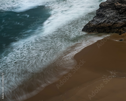 Looking down towards the shore line at the title flow, patterns the water as it reseeds
