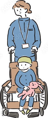 車椅子に乗った子供と介助する看護師の女性