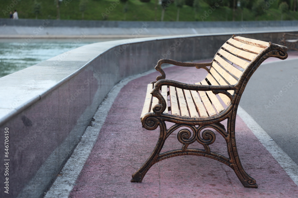 bench by the lake in the park in the city of Tashkent