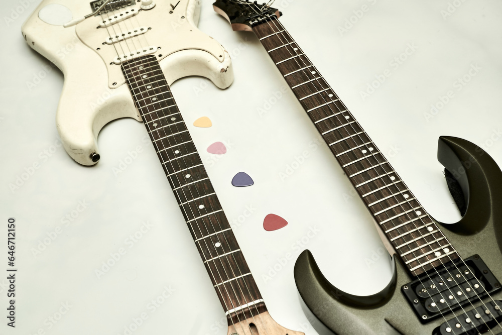 Fototapeta premium Black white electric guitars, plectrums, rock, pop, jazz,funk, metal