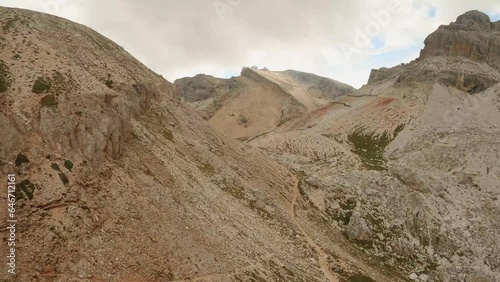 FPV drone races towards Forcella Travenanzes mountain pass in the Italian Dolomites, thrillingly skimming the ground in this high-speed aerial chase. LuPa Creative. photo