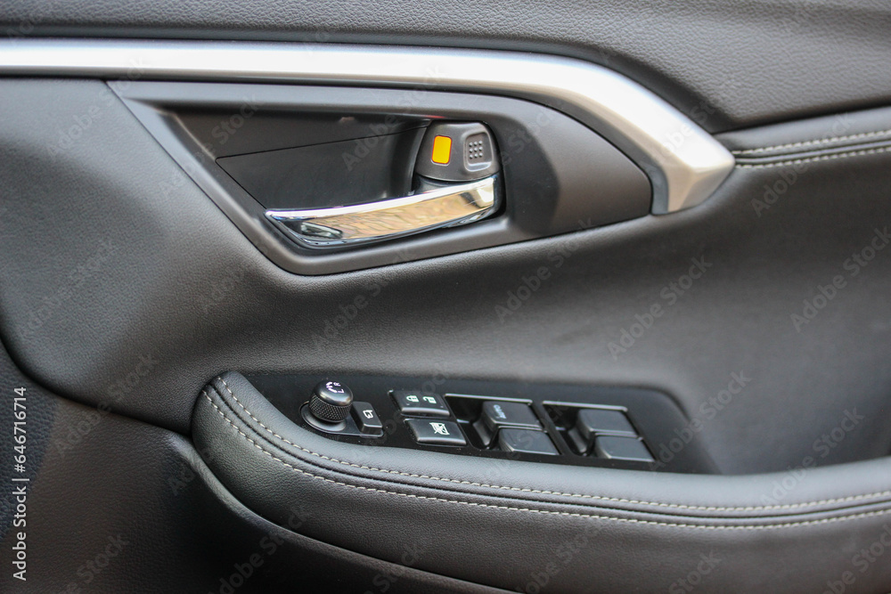 Door handle and window controls of a modern vehicle