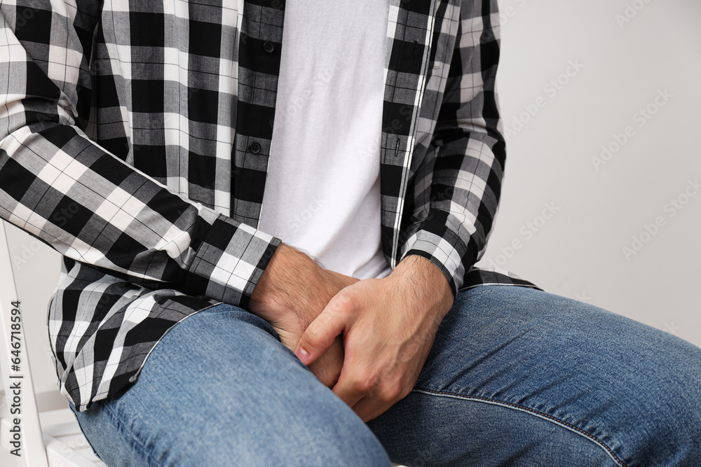 Man holding groin with hands, Movember concept Man holding groin with hands, Movember concept