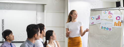 Seminar for motivation organize. Audience response with trainer in business training classroom.