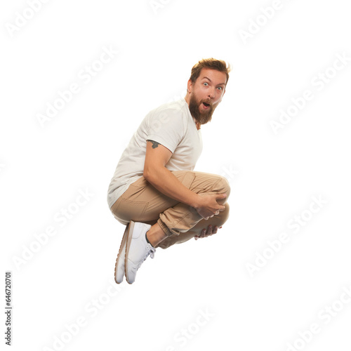 Man in casual clothes jumping with funny meme emotions isolated on white background. Diving into joy. Concept of youth, active lifestyle, motivation, emotions and facial expression. Ad © master1305