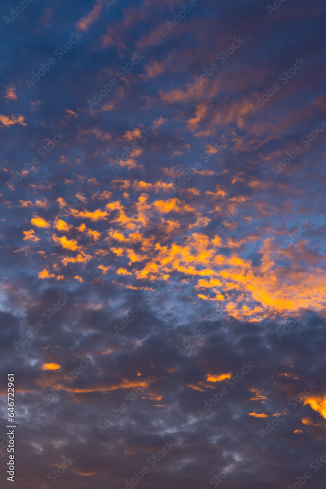 Beautiful golden cloud in a blue sky just before sunset. Scenic sundown