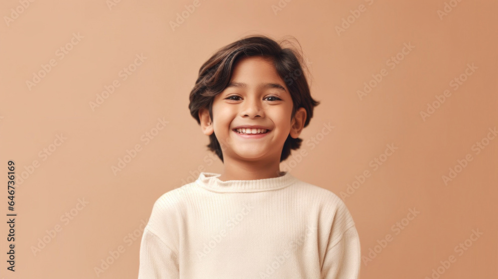 Cheerful young boy in neutral attire smiles in front of a beige studio backdrop. Generative AI Cheerful young boy in neutral attire smiles in front of a beige studio backdrop. Generative AI