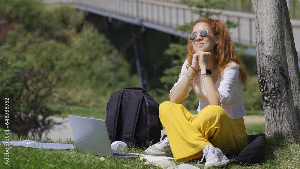 In the park, a university student dreams of a career while studying. In the park, a university student dreams of a career while studying.