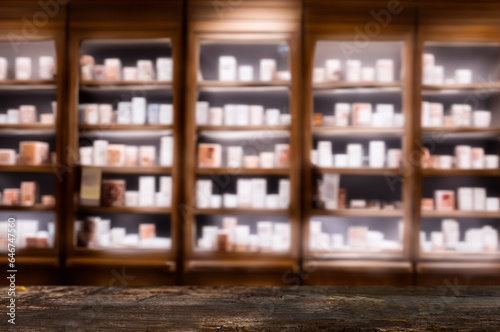Dark Wooden Counter with Blurred Pharmacy Shelves ideal for product presentations or mockups.