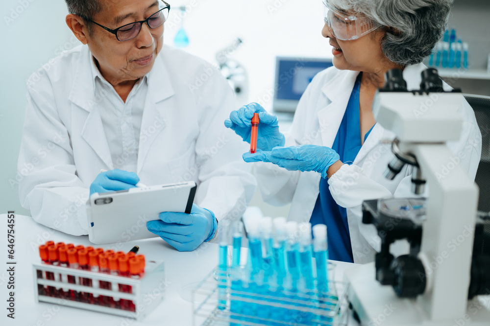 Asian senior Scientist team meeting and writing analysis results in the laboratory study and analyze scientific sample. Asian senior Scientist team meeting and writing analysis results in the laboratory study and analyze scientific sample.