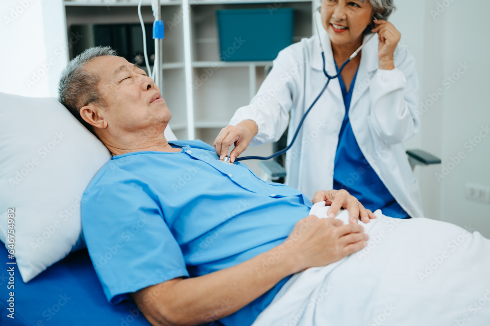 Obraz premium Female doctor holding male patient hand on the bed with receiving saline solution in hospital .