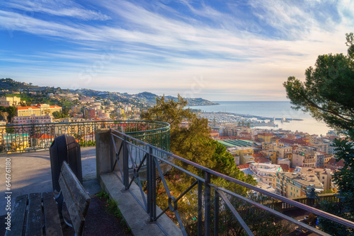 Panoramic view of Sanremo or San Remo from Pigna hill, Italian Riviera, Liguria, Italy. Scenic sunset landscape with city architecture, sea, green hills, blue water and sky, outdoor travel background photo