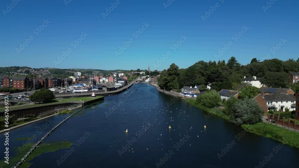Exeter, South Devon, England: DRONE VIEWS: Low angle view of Trews Weir, the River Exe, Exeter Quays and the city of Exeter, which is a popular UK tourist destination. Exeter, South Devon, England: DRONE VIEWS: Low angle view of Trews Weir, the River Exe, Exeter Quays and the city of Exeter, which is a popular UK tourist destination.