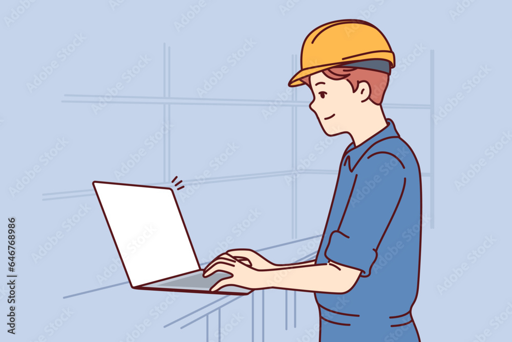 Man with laptop works as engineer in factory and performs setup of production machines, dressed in uniform and hardhat. System administrator of factory or industrial enterprise uses computer Man with laptop works as engineer in factory and performs setup of production machines, dressed in uniform and hardhat. System administrator of factory or industrial enterprise uses computer