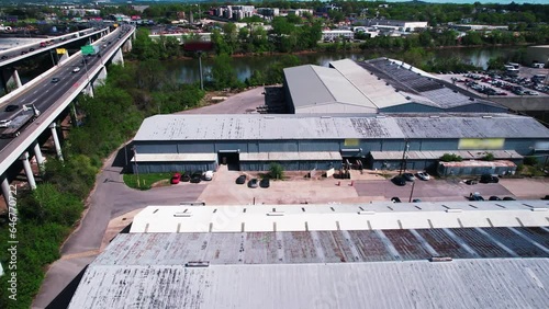 industrial warehouses in Nashville Tennessee next to Highway 24 Silliman Evans Bridge above lake. Aerial United States photo