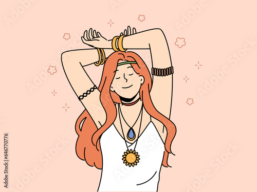 Hippie woman with amulet and bracelets on hands closes eyes, feeling pleasure or euphoria, and slowly dances with hands up. Red-haired young girl bows to hippie or woodstock subculture