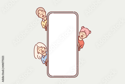 Children near giant phone with empty screen, to demonstrate kids application for schoolchildren