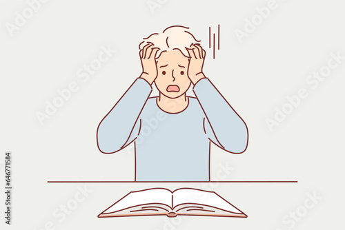 Shocked man reads book and tears hair out after learning scary facts from history