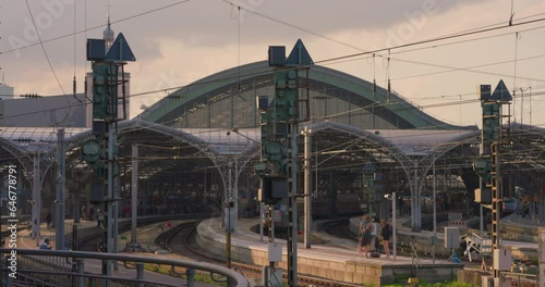 Train station in Germany in the city of Cologne. Cologne main station is one of Europe most important railway hubs. The train arrives at the railway station. Time lapse