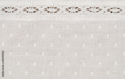 Texture of spotted fabric with a lace line