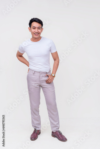 A handsome dapper FIlipino guy in a white shirt and light gray pants. Whole body photo, isolated on a white background.