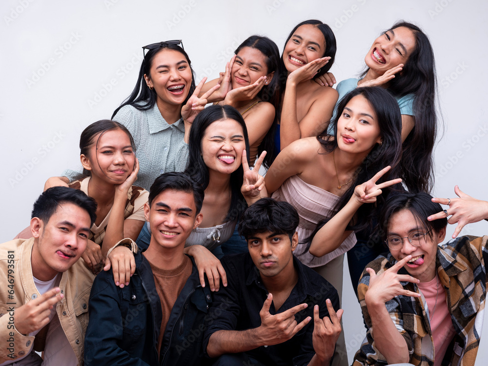 A diverse group of eleven young asian college students posing together smiling. 6 women, 4 guys and 1 trans woman. Isolated on a white background. A diverse group of eleven young asian college students posing together smiling. 6 women, 4 guys and 1 trans woman. Isolated on a white background.