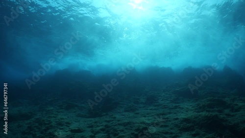 choppy water wavy sea underwater wave hit on rocks and makes foam on the surface of the sea ocean scenery backgrounds