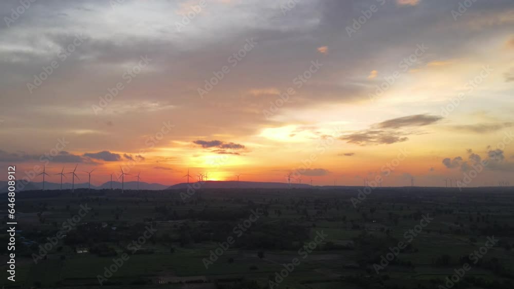 Wind turbine for generating electricity from wind power with beautiful sky and clouds in sunset time. View from drone Wind turbine for generating electricity from wind power with beautiful sky and clouds in sunset time. View from drone