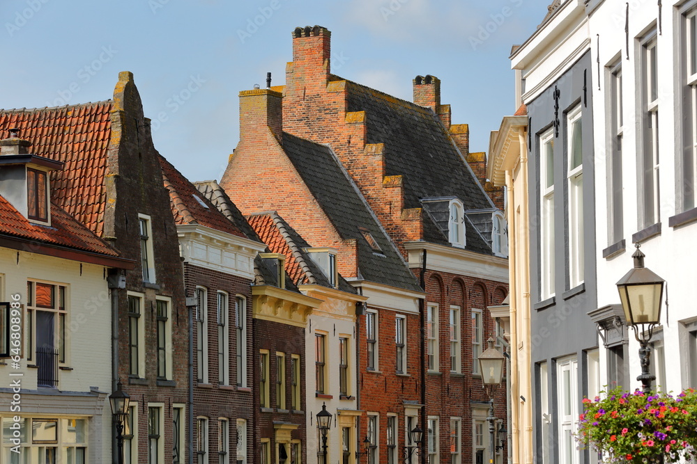 Fototapeta premium Traditional historic medieval houses in the old picturesque town of Doesburg, Gelderland, Netherlands, located on Veerpoortstraat street