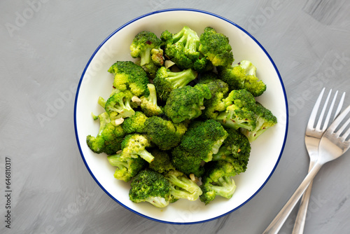 Homemade Pan-fried Broccoli on a Plate on a gray background, top view.