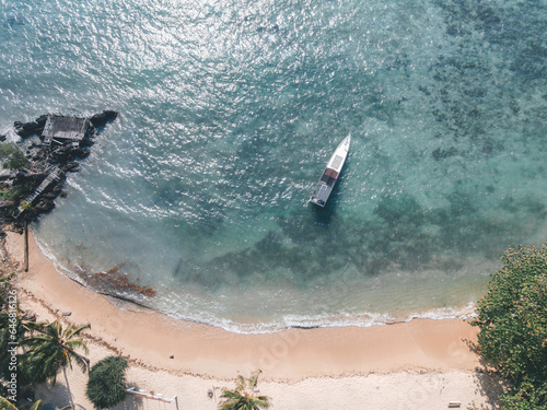 Aerial view of Kahyangan Beach in Karimunjawa Islands, Jepara, Indonesia. Remote Island, coral reefs, white sand beaches, long tail boat. photo