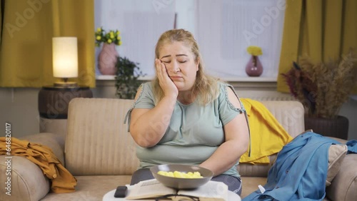 Lazy obesity woman thinking depressed at home and feeling sad.