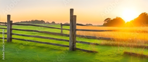 Wooden garden fence with grass at sunset from Generative AI