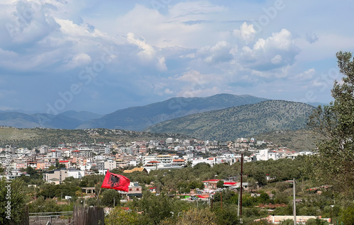 Albanian Flag Flying High. A Picturesque Mountain Village Landscape