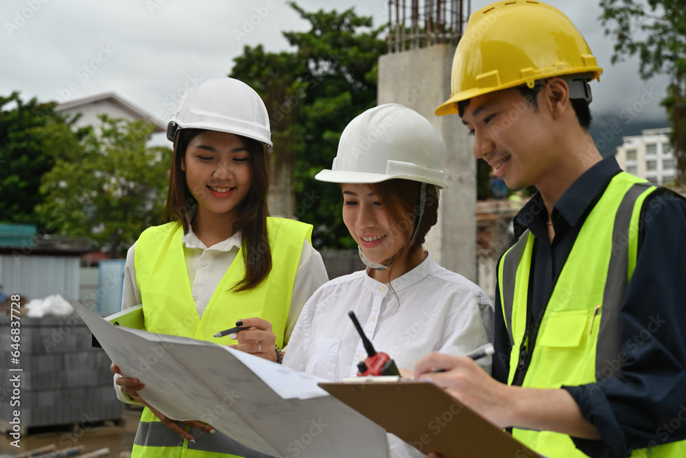 Portrait of Engineering team for building project, planning, and architecture. women and man contractors together for development and safety assessment discussion in construction site Portrait of Engineering team for building project, planning, and architecture. women and man contractors together for development and safety assessment discussion in construction site