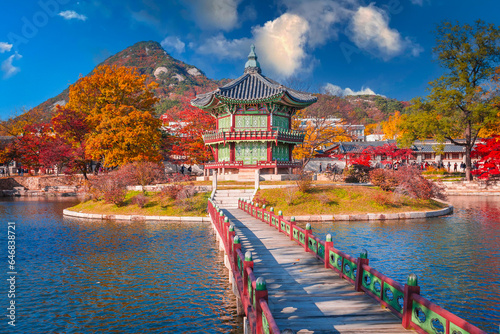 gyeongbokgung palace in autumn, lake with blue sky, Seoul, South Korea. photo