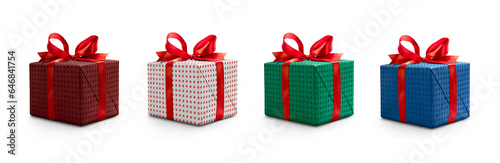 Obraz na płótnie A collection of red, blue and green gift wrapped Christmas, birthday or valentines presents with red ribbon bows isolated against a transparent background. w salonie