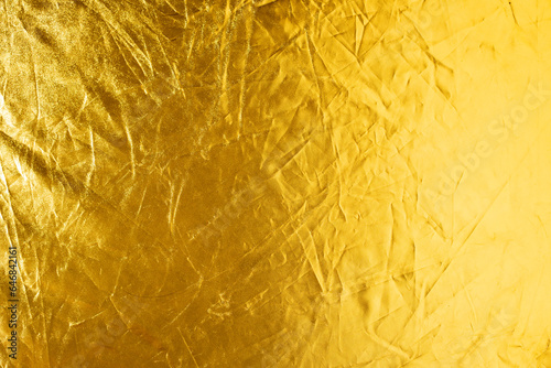 shiny gold color with creases texture abstract background